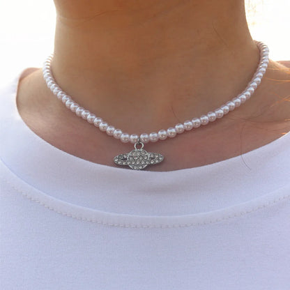 Vintage Saturn Pearl Necklace.